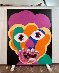 a painting with a colorful face on it