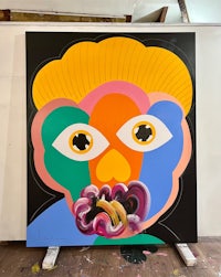 a painting with a colorful face on it