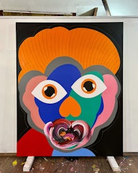 a painting with a colorful face on it