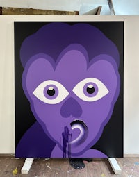 a painting with a purple face on it